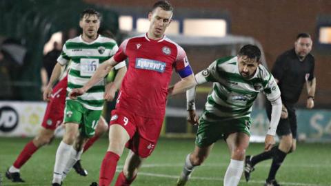 Bala's Chris Venables )centre) in action against New Saints' Ryan Brobbel