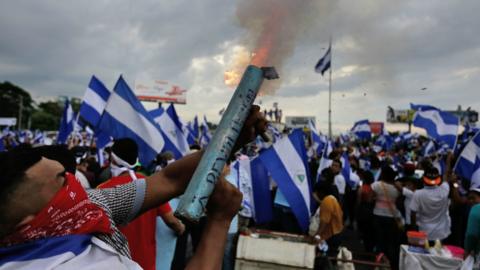 Anti-government demonstrator fires a home-made mortar during a protest in Managua on May 26, 2018