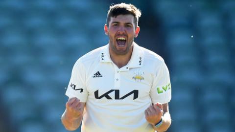 Jamie Overton celebrating a wicket for Surrey