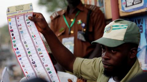 A National Youths Service Corp member counts ballot papers after voting closed at a polling station in Kano State, Nigeria February 23, 2019.