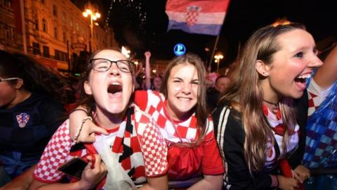 Croatia's supporters celebrate a goal as they watch Croatia -V-England at the main square in Zagreb