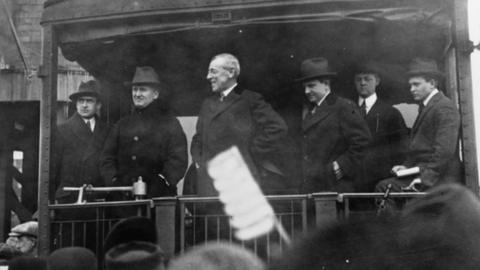 Woodrow Wilson, seen here on the back of a train, revived the practice of the spoken address