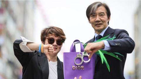 An opposition leader, Cho Kuk, campaigning with a Dior handbag and spring onions