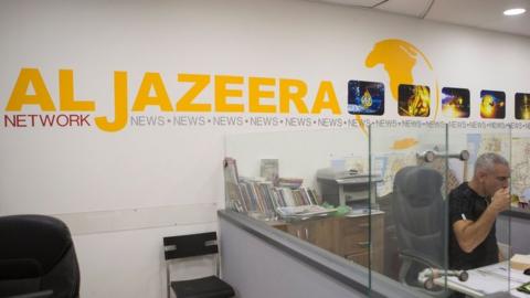 Employees of Al Jazeera satellite channel, work at their Jerusalem bureau, Israel, 14 June 2017