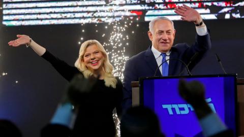 Benjamin Netanyahu and his wife Sara greet Likud supporters at the party's headquarters in Tel Aviv on 10 April 2019