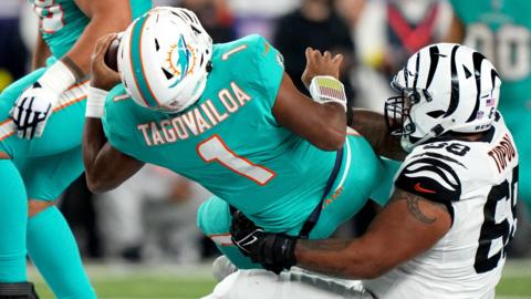 Miami Dolphins quarterback Tua Tagovailoa is sacked while playhing against Cincinnati Bengals