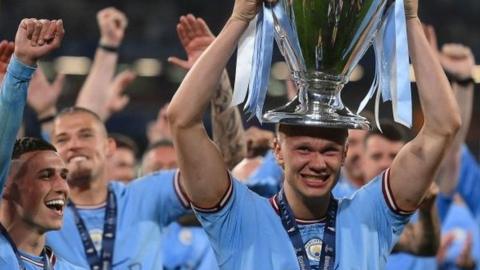 Manchester City's Erling Haaland lifts the Champions League trophy