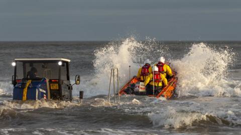 The Redcar RNLI inshore lifeboat was dispatched to rescue the three men and a boy