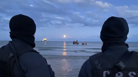 Police looking out to sea