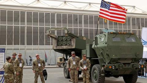 US military personnel stand by a HIMARS a defence show in Saudi Arabia in March.