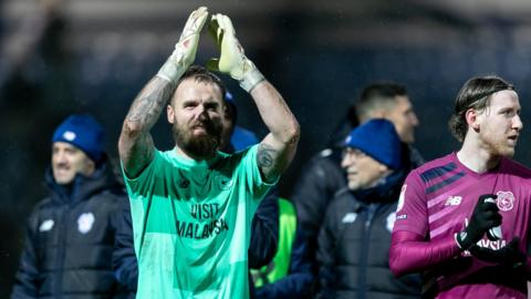 Goalkeeper Jak Alnwick applauds the fans after Cardiff's win over QPR