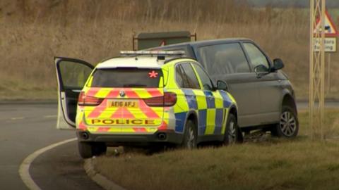 Police car and van following chase