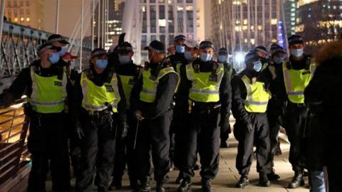 Police officers wearing face masks