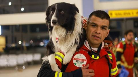 Photo of handler with his dog Orly at the airport in Mexico City