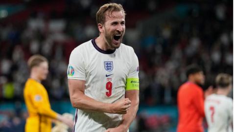 Harry Kane celebrates with England fans