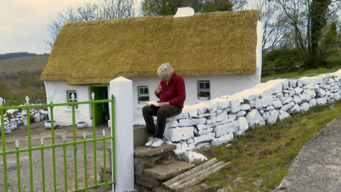 Margaret Gallagher outside the thatched cottage she has lived in since her birth in January 1942