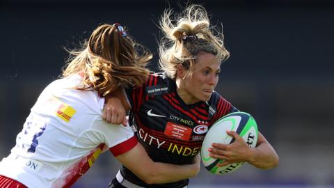 Vicky Fleetwood of Saracens is tackled by Izzy Mayhew of Harlequins during May's Premier 15s final