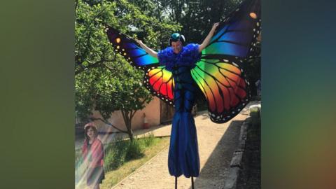 Person dressed as butterfly