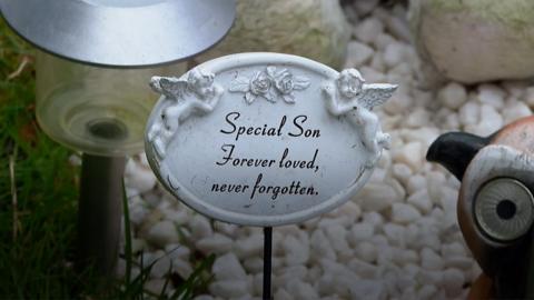 Message on a grave, reading: "Special son, forever loved, never forgotten"