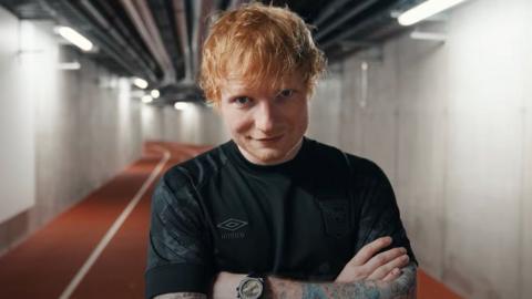 Ed Sheeran in Ipswich Town kit