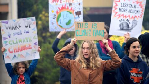 Protesters rally outside as New South Wales Premier Gladys Berejiklian meets with Rural Fire Service Deputy Commissioner Rob Rogers at the Blue Mountains Fire Control Centre in Katoomba, Australia,