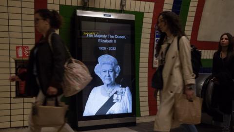 An image of HM The Queen in a London Underground station