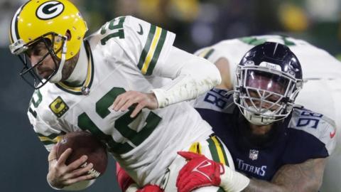 Green Bay Packers quarterback Aaron Rodgers is sacked by Tennessee Titans defensive tackle Jeffery Simmons