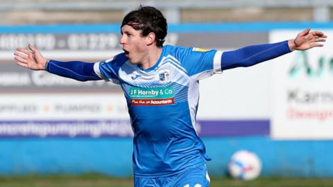 Barrow's Jamie Devitt celebrates