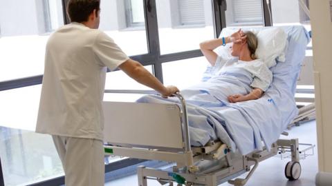 File picture of patient on a hospital trolley