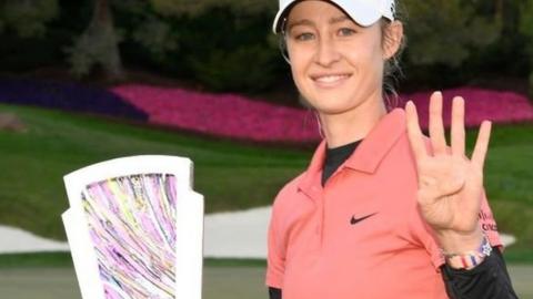 Nell Korda holds up four fingers to indicate her number of consecutive wins after claiming the Match Play title