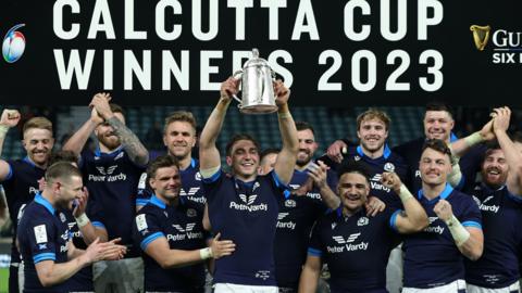 Jamie Ritchie, the then captain of Scotland, raises the Calcutta Cup after his side's victory over England at Twickenham in 2023