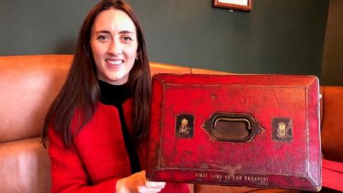 Alice Loxton holding a prime minister's despatch box from the 1840s