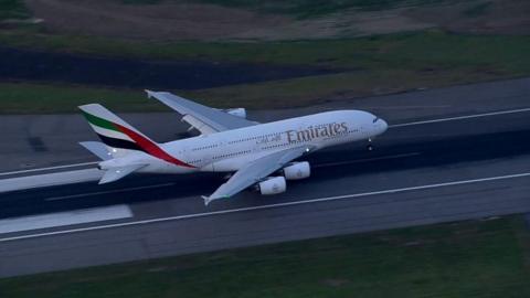 Emirates plane lands on runway