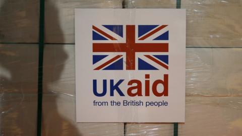 UK aid sign on box
