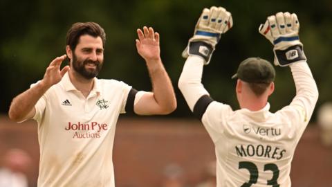 Brett Hutton celebrates taking a wicket against Somerset