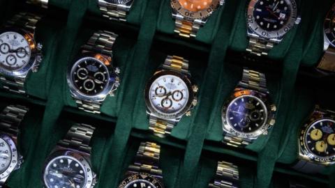 A tray of Rolex watches are seen on a dealer's stand at the London Watch Show on March 19, 2022 in London