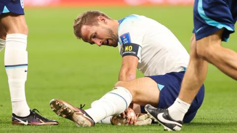 Harry Kane after hurting his ankle against Iran