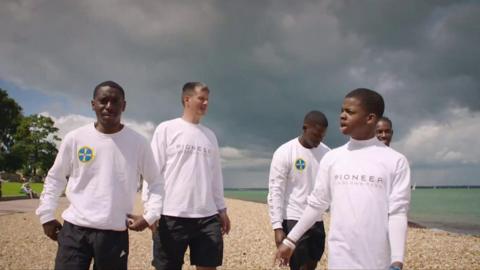 Sailors on beach