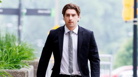 Michael McLeod arrives at court as the defence begins closing arguments in the trial against five teammates on Canada's 2018 gold medal-winning world junior hockey team, charged with sexually assaulting a woman in a hotel room, at the Superior Court of Justice in London, Ontario.