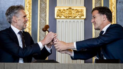 Dick Schoof and Mark Rutte attend a handover ceremony