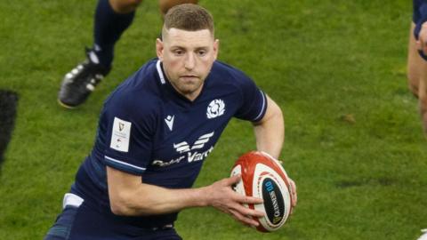 Finn Russell in action for Scotland against Wales in 2024