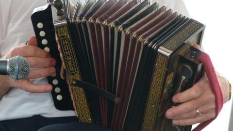 An accordion being played