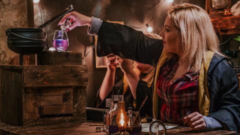 Woman mixing potions