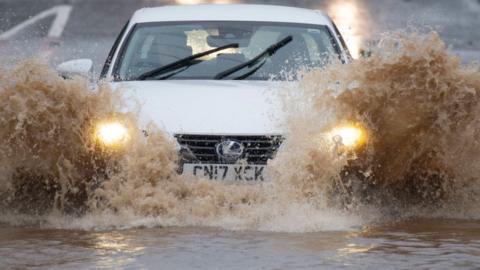 Car on flooded road in Bonvilston, Vale of Glamorgan