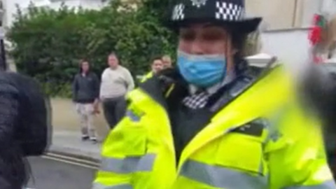 Unnamed police officer at demonstration