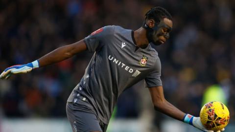 Arthur Okonkwo prepares to kick ball from hand