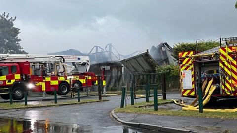 Firefighters remain at the scene of the blaze an the industrial unit in West Sussex
