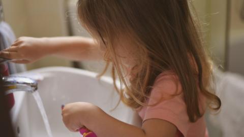 Stock image of a child with a toothbrush