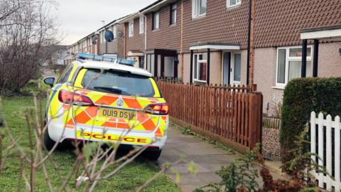 Police car outside house in Biggleswade