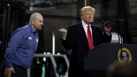 President Donald Trump introduces Ken Wilson, an employee of H&K Equipment, to supporters at a rally at H&K Equipment, a rental and sales company for specialized material handling solutions on January 18, 2018 in Coraopolis, Pennsylvania